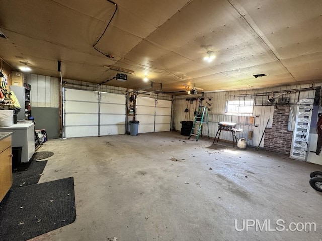 437 N Main St, Lanse, MI 49946 - garage with a garage door opener