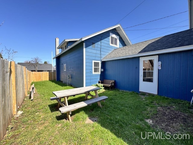 437 N Main St, Lanse, MI 49946 - back of house featuring outdoor dining area