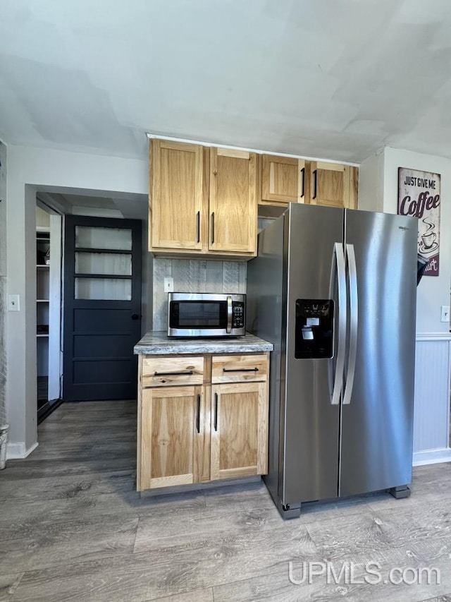 437 N Main St, Lanse, MI 49946 - kitchen with stainless steel appliances and light wood finished floors