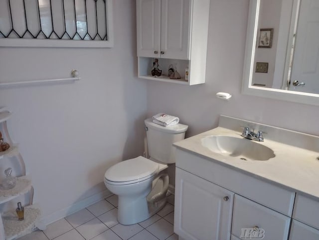 1726 Berkshire Dr, Gladwin, MI 48624 - half bathroom featuring toilet, tile patterned flooring, and vanity