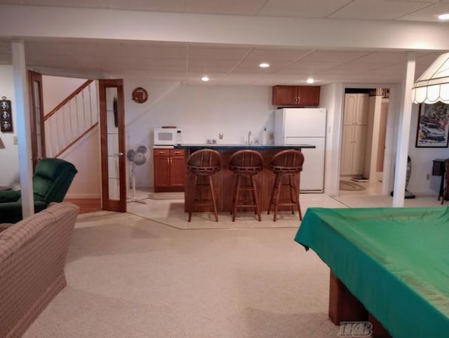 1726 Berkshire Dr, Gladwin, MI 48624 - playroom featuring bar with sink, light colored carpet, and recessed lighting