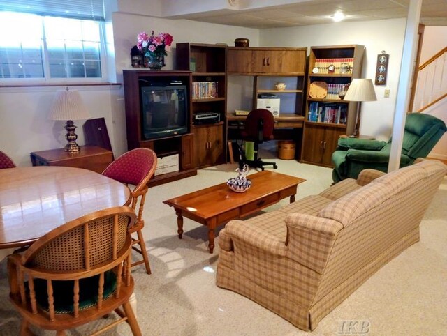 1726 Berkshire Dr, Gladwin, MI 48624 - living area featuring light carpet and stairs