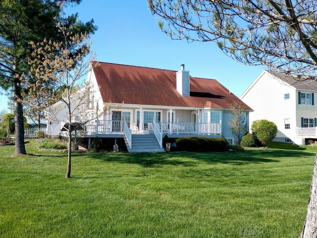 1726 Berkshire Dr, Gladwin, MI 48624 - rear view of property featuring stairs, a chimney, a yard, and a wooden deck