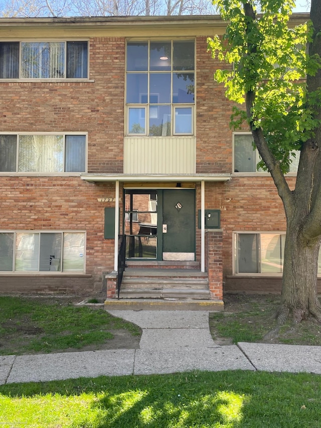 view of front of home with brick siding