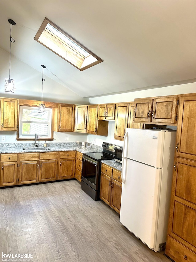 9602 Cornell Ave, Clarkston, MI 48348 - kitchen with freestanding refrigerator, stainless steel electric range, a sink, lofted ceiling, and brown cabinetry