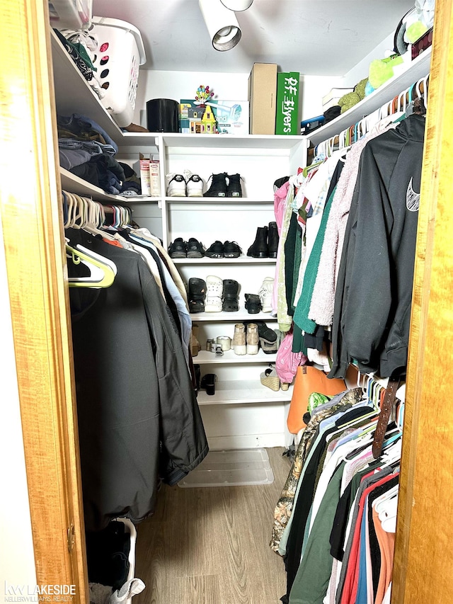 9602 Cornell Ave, Clarkston, MI 48348 - walk in closet featuring wood finished floors