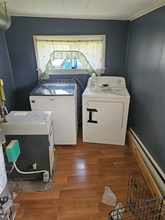 112 Euclid St, Saint Louis, MI 48880 - laundry room featuring washing machine and clothes dryer, wood finished floors, and a baseboard radiator