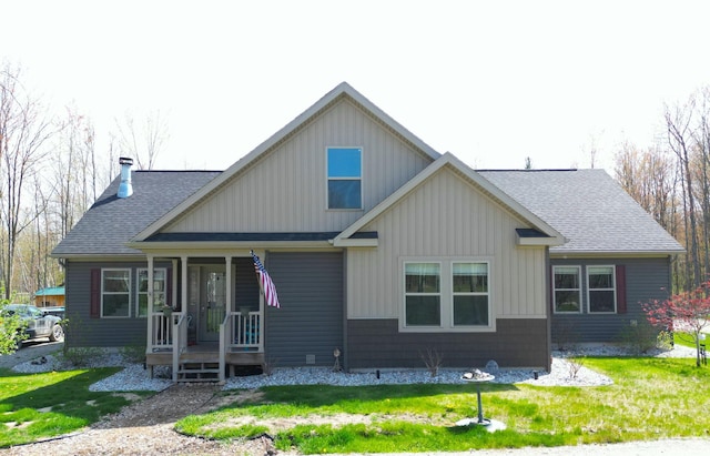 3787 Shepherd Rd, Midland, MI 48880 - view of front of property with covered porch, a front yard, and a shingled roof