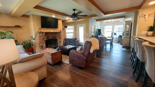 3787 Shepherd Rd, Midland, MI 48880 - living room featuring a fireplace, a ceiling fan, dark wood-style floors, and healthy amount of natural light