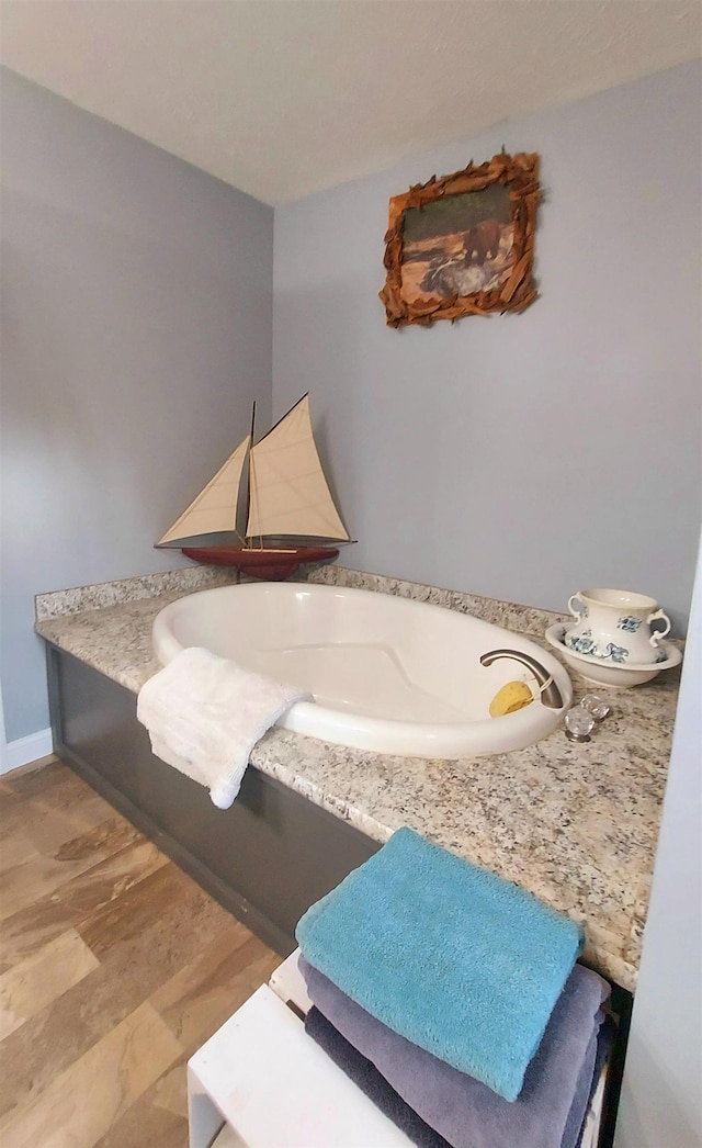 3787 Shepherd Rd, Midland, MI 48880 - bathroom featuring a tub to relax in