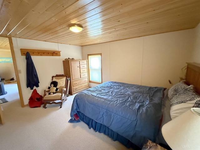 carpeted bedroom featuring wood ceiling