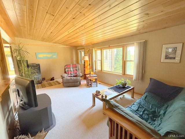 living area with carpet floors, lofted ceiling, and wood ceiling