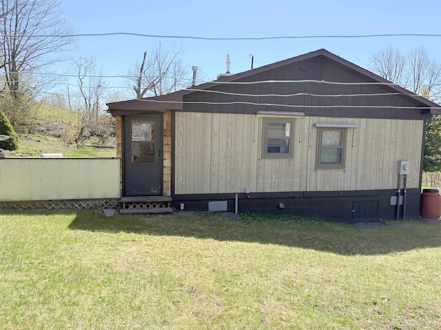 view of home's exterior with a yard