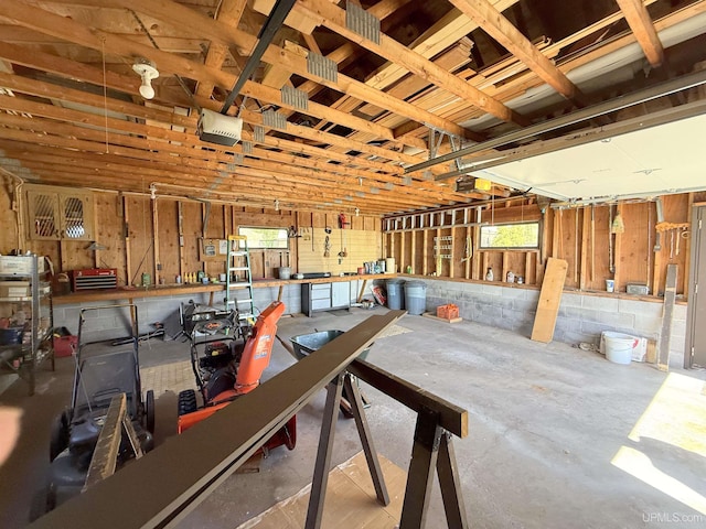 garage featuring a workshop area and a garage door opener