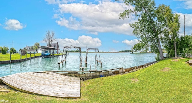 dock area featuring a yard and a water view