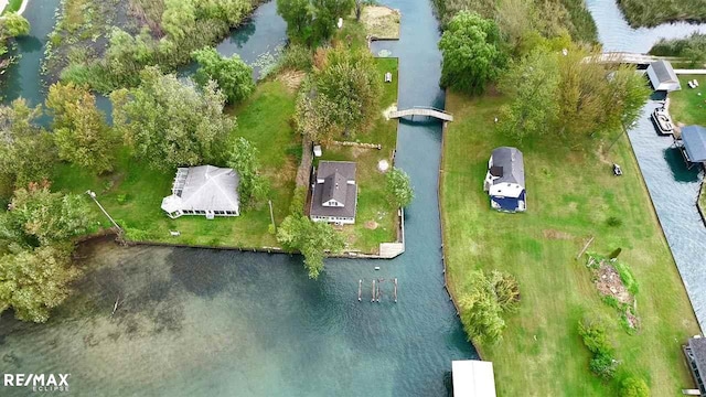 aerial view of property's location with a large body of water