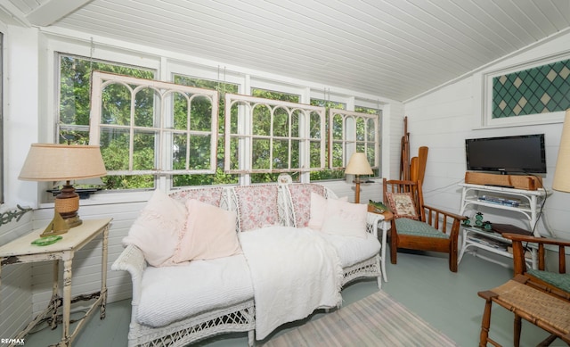 sunroom featuring vaulted ceiling