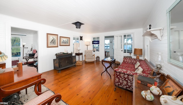 living area featuring plenty of natural light and hardwood / wood-style floors