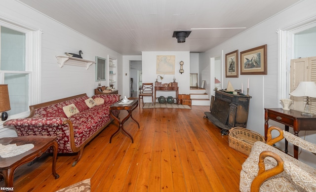 living area featuring hardwood / wood-style floors and stairs