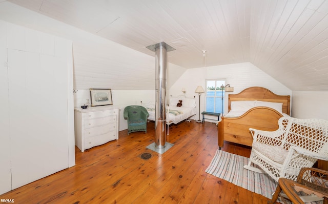 bedroom featuring lofted ceiling, hardwood / wood-style floors, and wooden ceiling