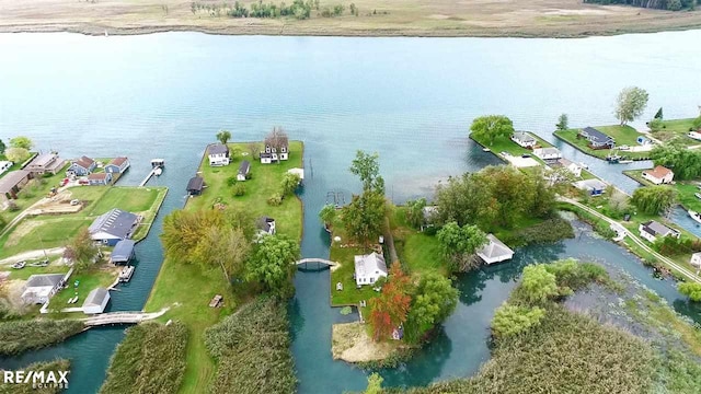 aerial overview of property's location with a large body of water and nearby suburban area