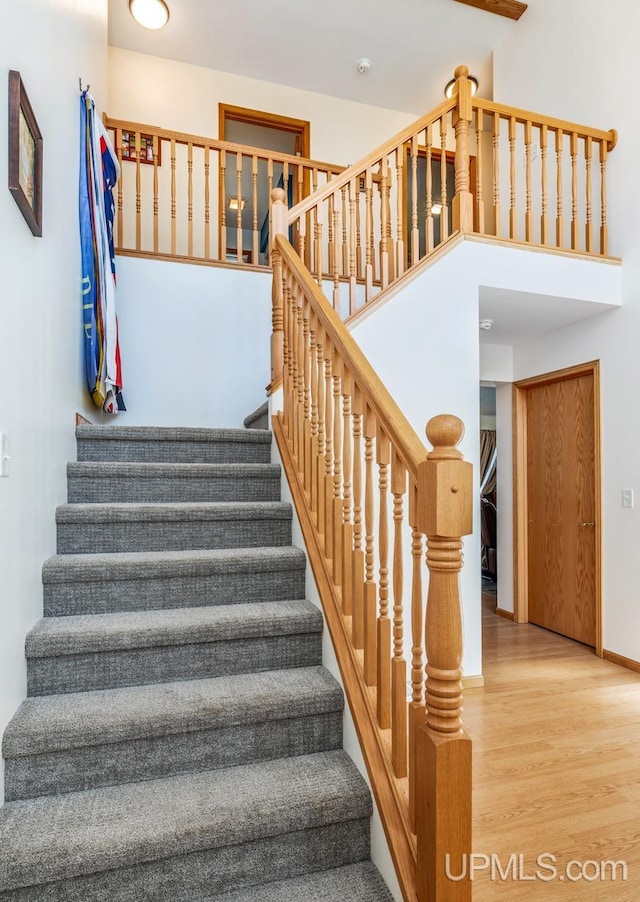 1000 N Evergreen Dr, Iron Mountain, MI 49801 - stairs featuring wood finished floors and baseboards