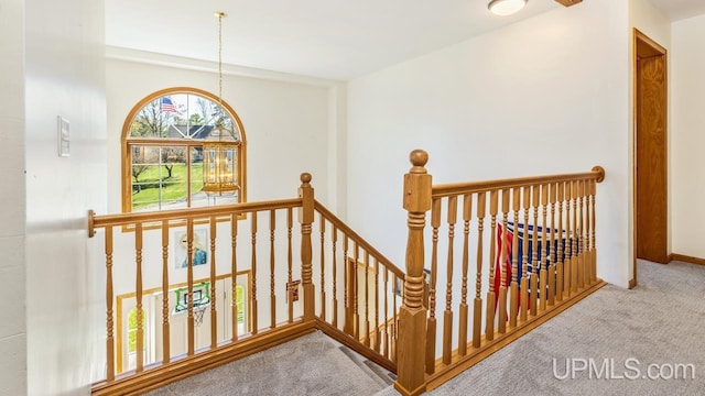 1000 N Evergreen Dr, Iron Mountain, MI 49801 - stairs featuring carpet flooring and baseboards