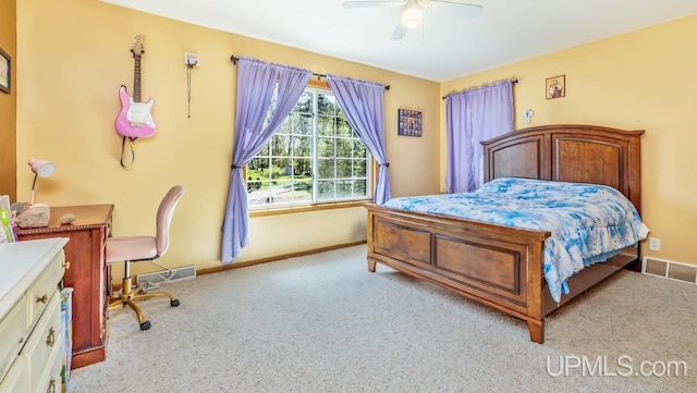 1000 N Evergreen Dr, Iron Mountain, MI 49801 - bedroom featuring carpet flooring, baseboards, and a ceiling fan