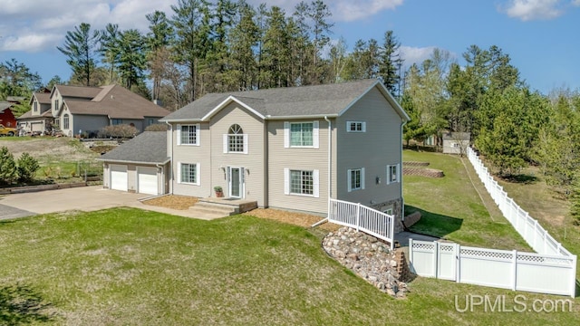 1000 N Evergreen Dr, Iron Mountain, MI 49801 - view of front of house with concrete driveway and an attached garage