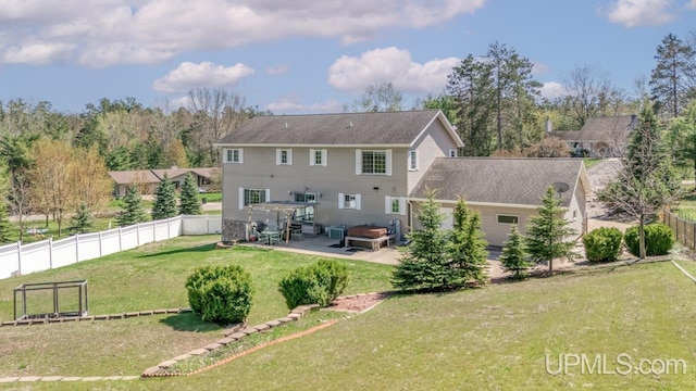 1000 N Evergreen Dr, Iron Mountain, MI 49801 - back of property featuring a patio area and a hot tub