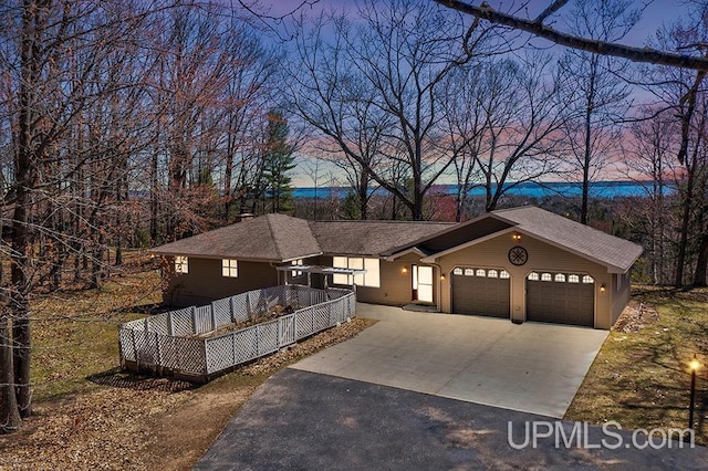 8962 Stagecoach Q.5 Ave, Gladstone, MI 49837 - view of front of house featuring driveway and an attached garage