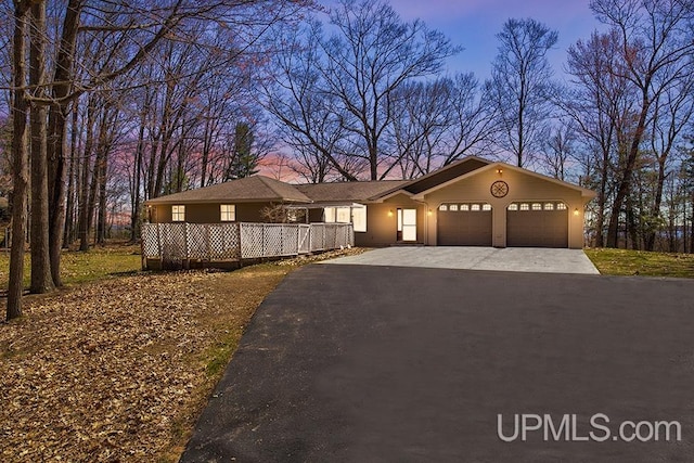 8962 Stagecoach Q.5 Ave, Gladstone, MI 49837 - view of front facade with an attached garage and driveway