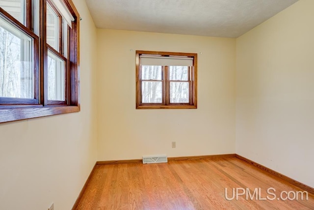 8962 Stagecoach Q.5 Ave, Gladstone, MI 49837 - empty room with light wood finished floors and baseboards