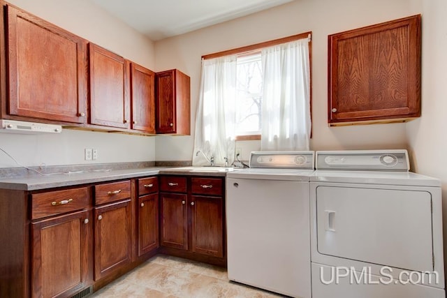 8962 Stagecoach Q.5 Ave, Gladstone, MI 49837 - laundry area with washer and clothes dryer and cabinet space