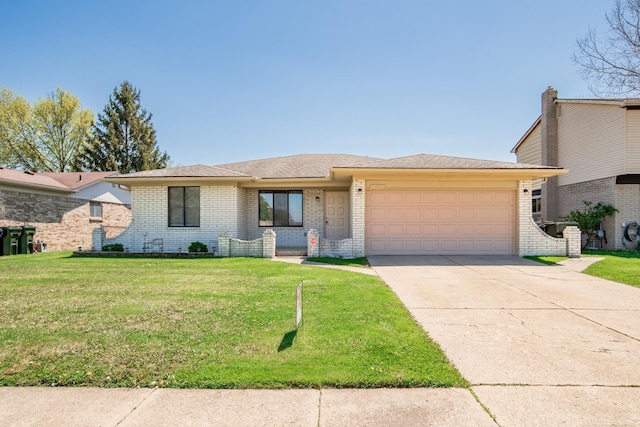 view of front of house with an attached garage, driveway, brick siding, and a front lawn