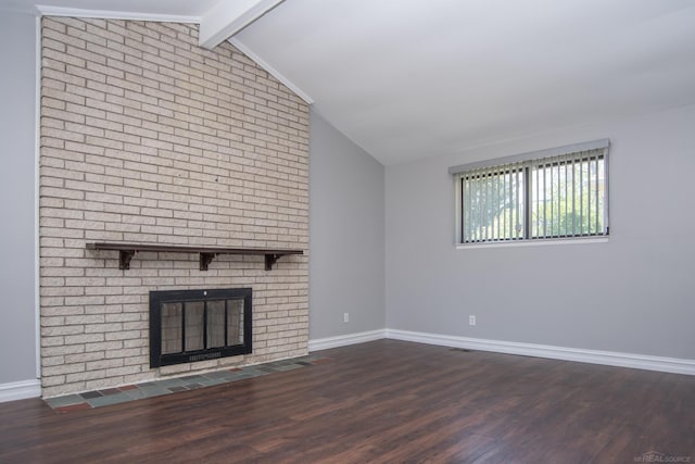 unfurnished living room featuring wood finished floors, baseboards, and a brick fireplace