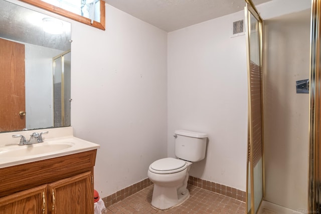 full bath with toilet, tile patterned floors, and vanity