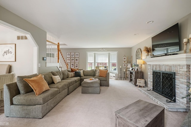35657 Pierce St, Richmond, MI 48062 - carpeted living area featuring stairway and a brick fireplace