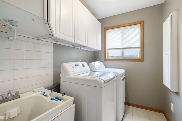 35657 Pierce St, Richmond, MI 48062 - washroom featuring cabinet space, separate washer and dryer, light tile patterned floors, and baseboards