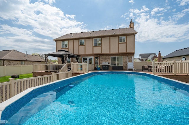 35657 Pierce St, Richmond, MI 48062 - view of swimming pool with a gazebo, a fenced backyard, and a deck