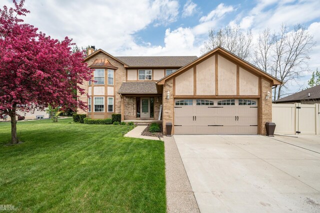 35657 Pierce St, Richmond, MI 48062 - english style home with a garage, driveway, a chimney, stucco siding, and brick siding