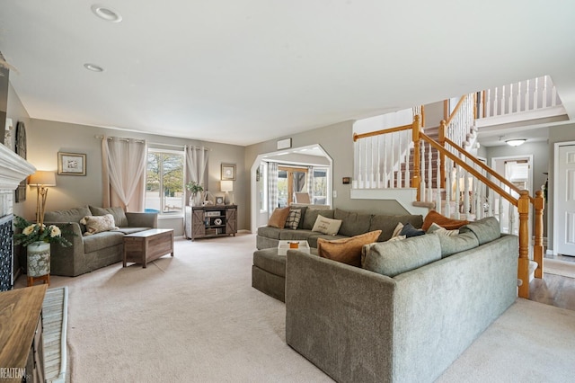 35657 Pierce St, Richmond, MI 48062 - living room with stairway, a fireplace, light colored carpet, and recessed lighting