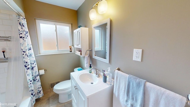 full bathroom featuring toilet, tile patterned floors, and vanity