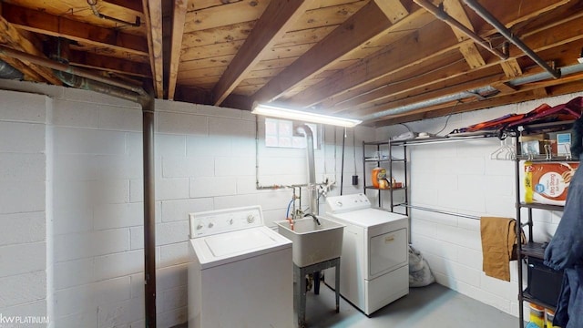 clothes washing area with independent washer and dryer