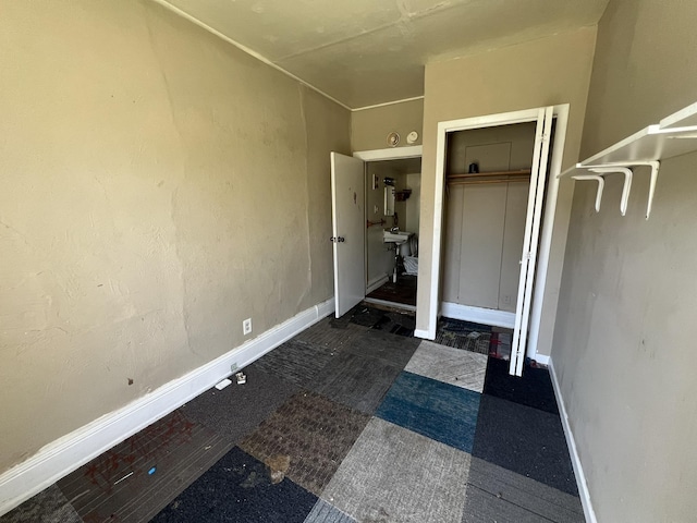 106 S Chilson St, Bay City, MI 48706 - unfurnished bedroom with baseboards and a closet
