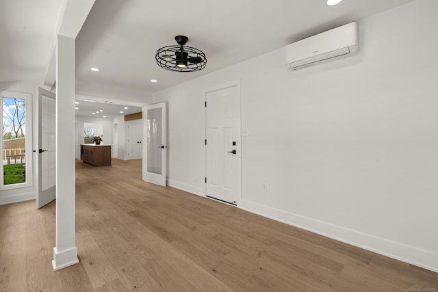 7533 Roberta Ln, Washington T-Wi, MI 48094 - foyer with an AC wall unit, recessed lighting, baseboards, and light wood-style floors