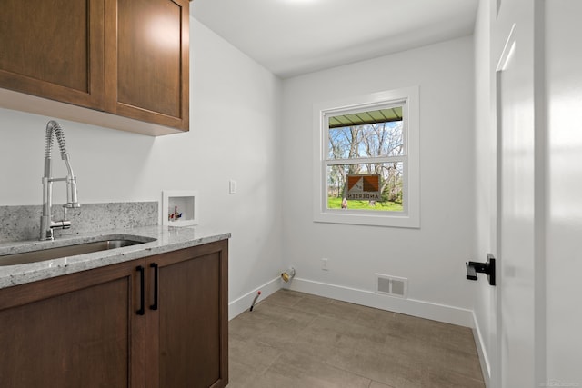 7533 Roberta Ln, Washington T-Wi, MI 48094 - clothes washing area featuring cabinet space, hookup for a washing machine, and baseboards