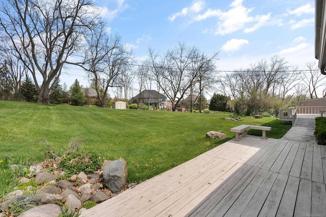 7533 Roberta Ln, Washington T-Wi, MI 48094 - view of green lawn with a deck, a shed, and an outdoor structure