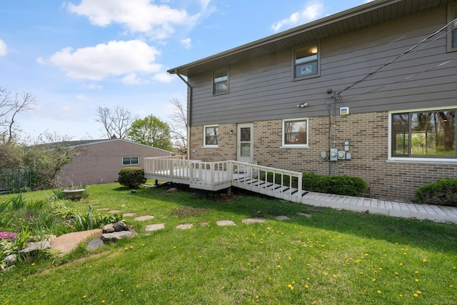 7533 Roberta Ln, Washington T-Wi, MI 48094 - rear view of property with brick siding, a yard, and a deck