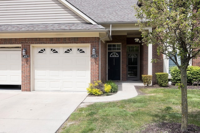 14225 Shadywood Dr, Sterling Heights, MI 48312 - doorway to property with brick siding, a shingled roof, concrete driveway, and a garage